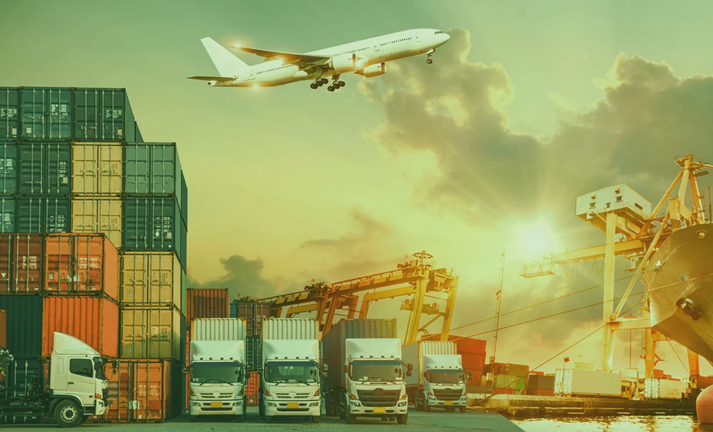 Trucks, containers, cranes and an aircraft at a port