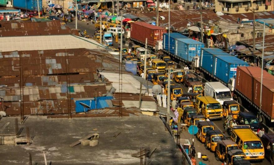 Container trucks moving through Lagos traffic